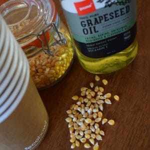 Waste Free Event, Glass bottle of oil, loose corn kernels and eco food packaging